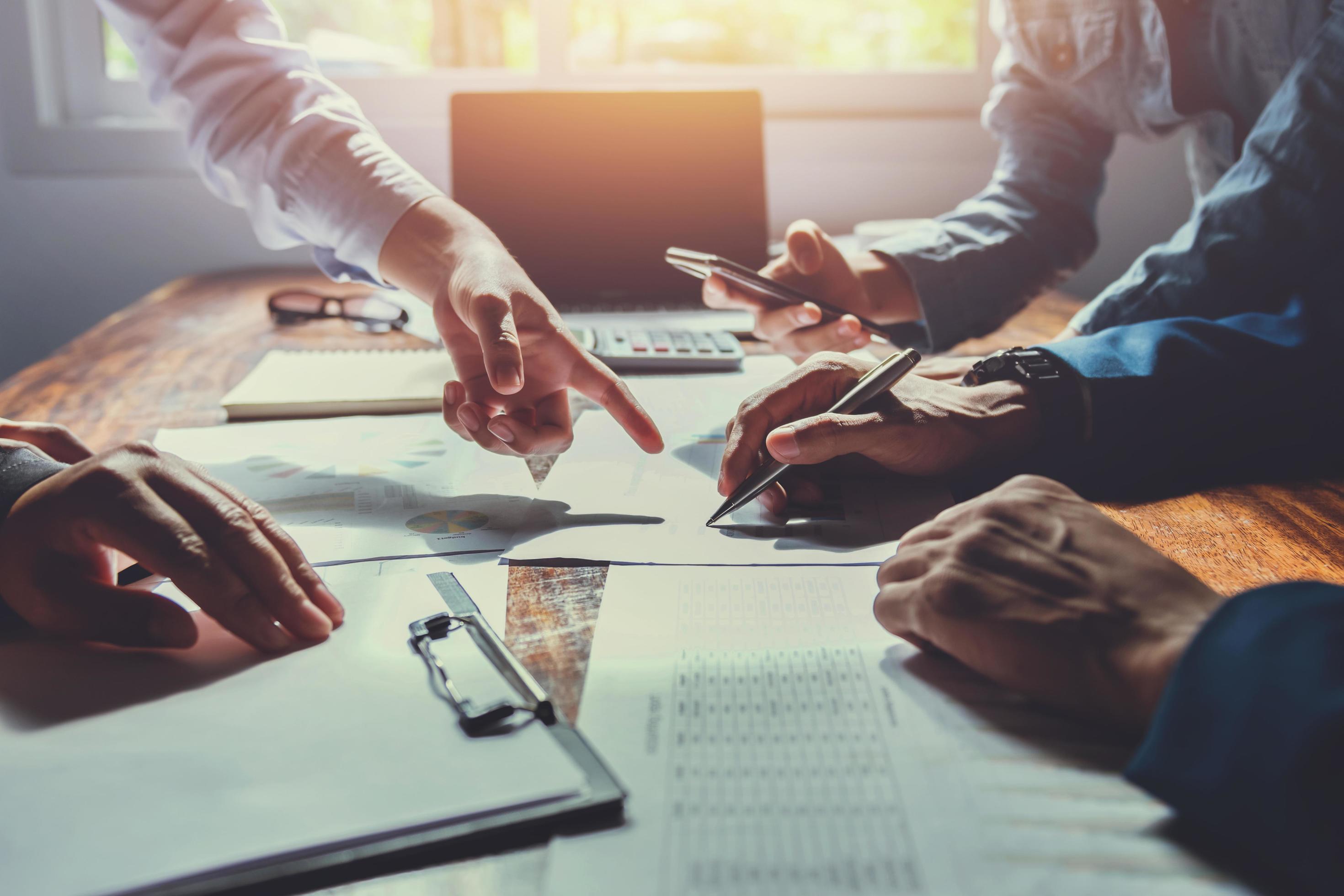 Professional business team analyzing financial data and receivables management